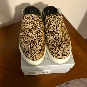 Sole Society black and gold fur slides.